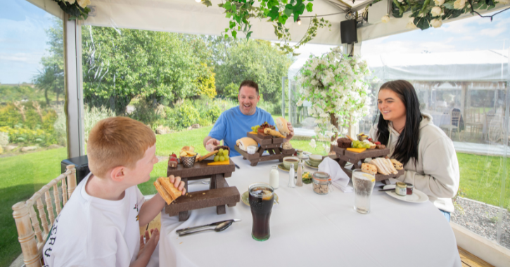 dad and his two teenage children enjoying afternoon tea at South Causey Inn